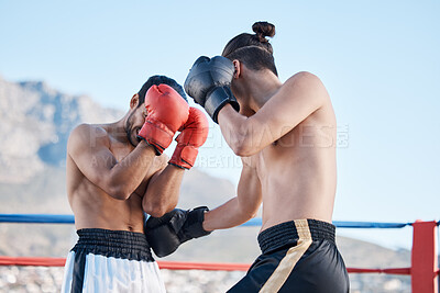 Buy stock photo Punch, boxing match or men fighting in sports training, exercise or fist punching with strong power. Fitness action, boxers or combat fighters boxing in practice workout in ring on rooftop in city