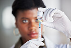 Vaccine vial, needle and doctor for safety, healthcare and pharmaceutical medicine. Closeup, hands of woman and prepare vaccination, virus injection and bottle for immunity, medical drugs or flu shot