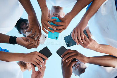 Buy stock photo Hands, phone and app with people in a huddle or circle for communication or connectivity. Mobile, social media or information sharing with a group of men networking together closeup from below