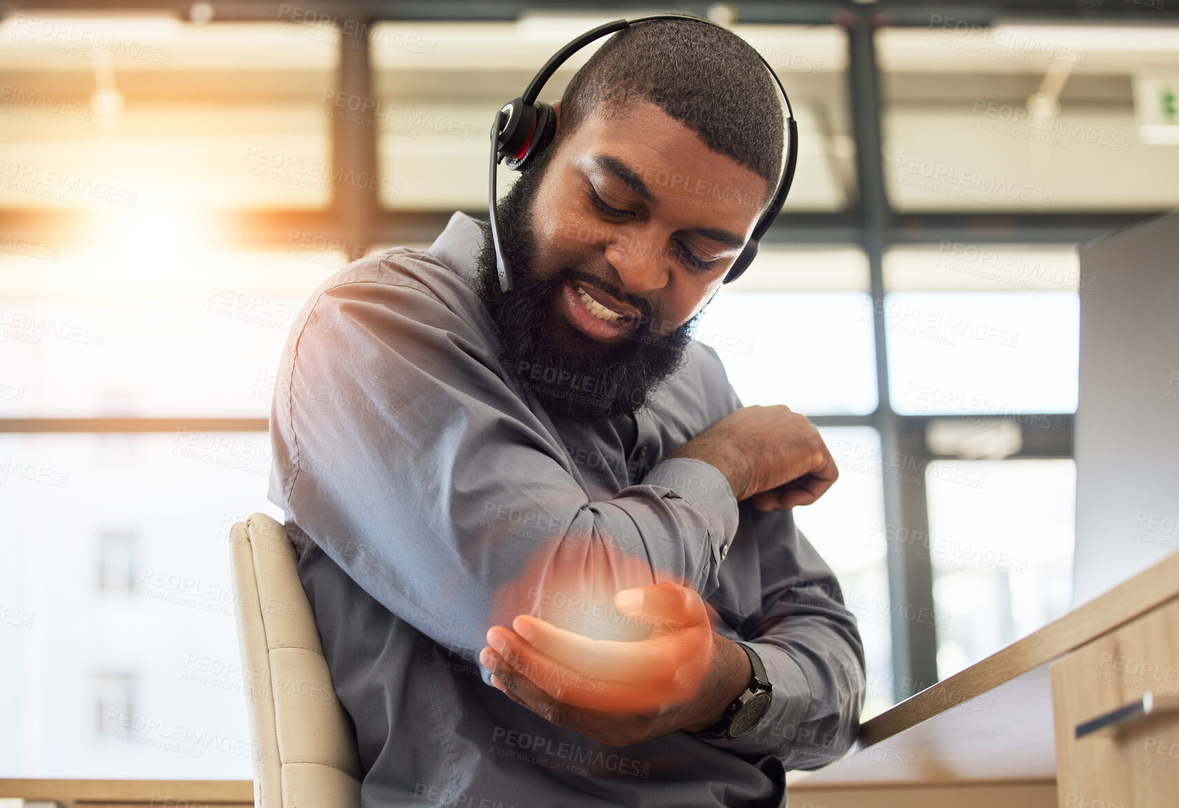 Buy stock photo Black man, elbow pain and working in call center, injury and sick with overlay, customer service and health problem. Male agent, CRM and headset with mic, fibromyalgia and muscle tension with glow