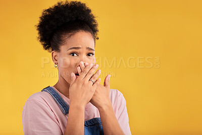 Buy stock photo Shocked, surprise and portrait of woman with wow reaction to news isolated in a yellow studio background. Expression, omg and young female person covering mouth due to gossip or announcement