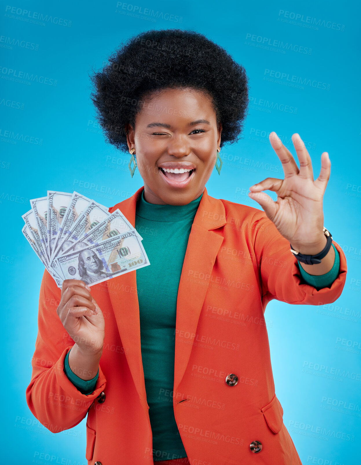 Buy stock photo Money, okay sign and woman or winner success, profit and sales deal with yes and wink emoji on blue background. Portrait of rich african person with financial, cash and bonus achievement in studio