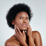 Face, skincare and beauty of black woman, touch and isolated in studio on a white background. Serious, natural and African model with cosmetics, facial treatment and aesthetic, wellness and health