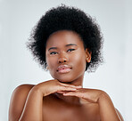 Beauty, face and skincare of black woman with hands in studio isolated on a white background. Portrait, serious and natural model with cosmetics, spa facial treatment or aesthetic, wellness or health
