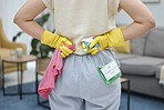 Back of woman, cleaning cloth and bottle with gloves for home disinfection of dirt, bacteria and dust. Closeup hands of female person ready for housekeeping with chemical spray and detergent product