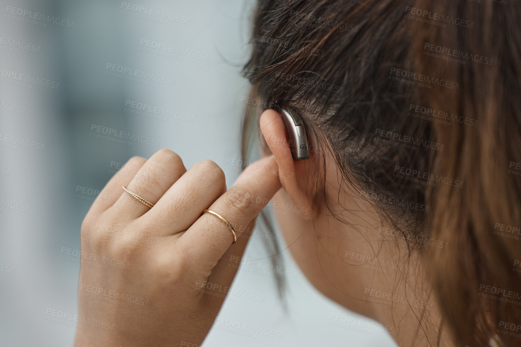 Buy stock photo Hearing aid, closeup and ear of woman with disability from the back for medical support, listening or healthcare tech. Deaf female patient with audiology implant for sound waves, amplifier and volume