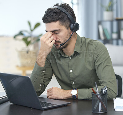 Buy stock photo Man, laptop and headache in call center, stress or debt in customer service or support at the office. Male person, consultant or agent with headphones and bad head pain in burnout at the workplace