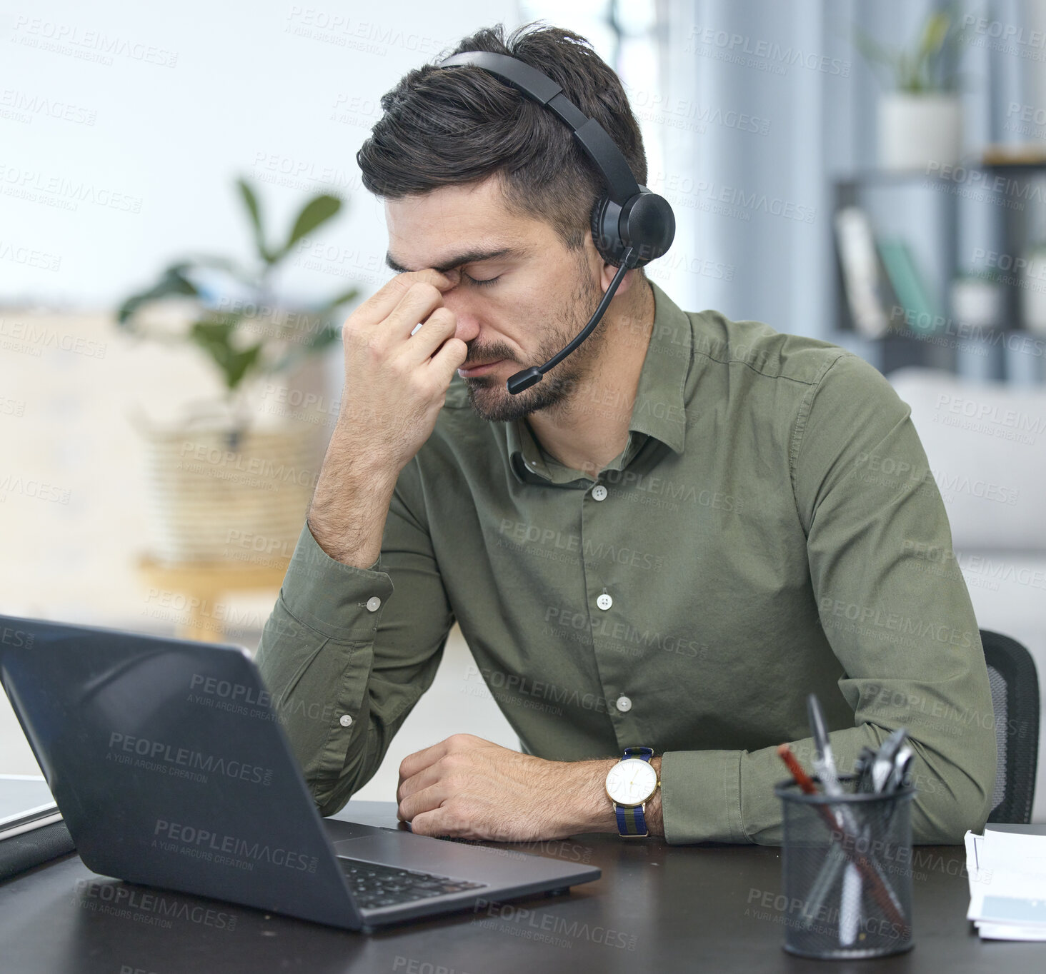 Buy stock photo Man, laptop and headache in call center, stress or debt in customer service or support at the office. Male person, consultant or agent with headphones and bad head pain in burnout at the workplace