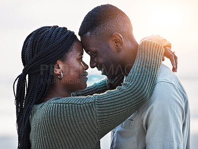 Buy stock photo Couple, beach and touch forehead outdoor for love, care and commitment. Profile of a young black man and a happy woman together on a romantic vacation, holiday or sunset travel adventure in Jamaica