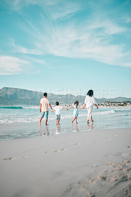 Buy stock photo Family is walking on beach, hand holding and back view, ocean and bonding on holiday, freedom and travel. Parents, young children and solidarity on tropical vacation in Mexico, love and care outdoor