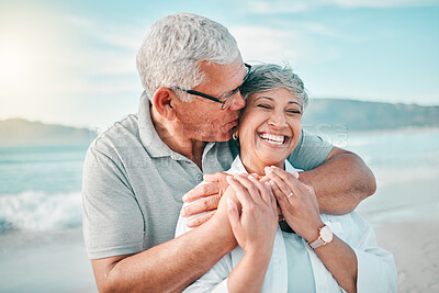 Buy stock photo Happy, kiss or old couple laughing on beach with love, care or support on summer vacation in nature. Retirement, mature man hugging or funny senior woman at sea or ocean to travel on holiday together