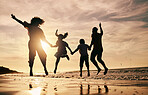 Silhouette, family jump on beach and back view with ocean waves, sunset and bonding in nature. Energy, people holding hands in air outdoor and holiday, freedom and travel, trust and love in Mexico