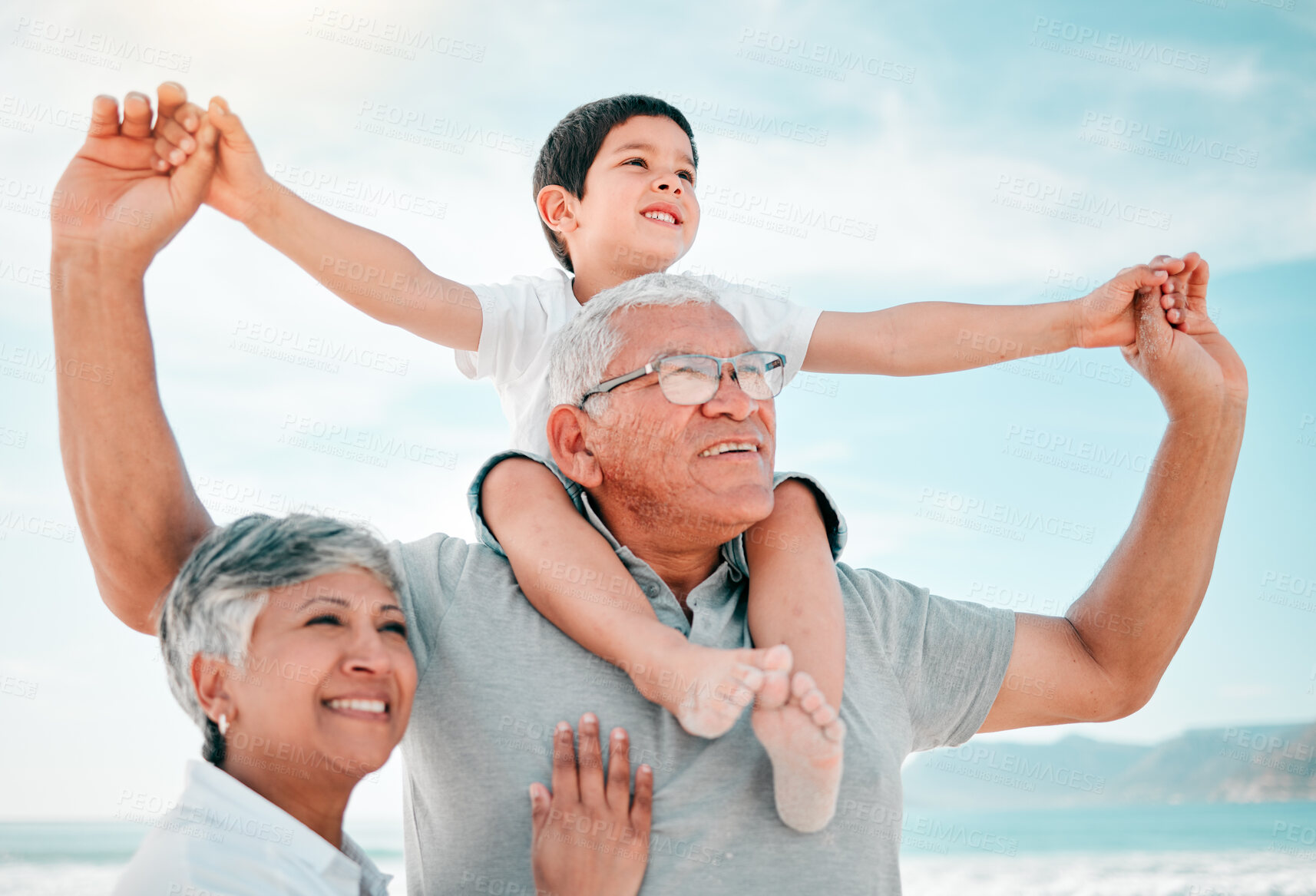 Buy stock photo Beach, family and child on grandfather shoulder with grandmother outdoor, love and bond on holiday. Summer, happiness and people in nature, tropical vacation in Mexico with old man, woman and boy kid