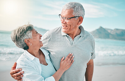 Buy stock photo Happy, hug or old couple laughing on beach with love, care or support on summer vacation in nature. Retirement, mature man talking or funny senior woman at sea or ocean to travel on holiday together