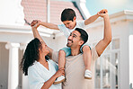 Happy, love and young family bonding outdoor in the backyard of their modern house. Happiness, smile and boy child playing with his parents in the outside garden for fresh air by their new home.