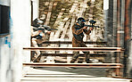 Paintball, battlefield and team, motion blur and attack with target, soldier with gun and fight. Power, war and action, challenge and war games, military tactics and army teamwork with people outdoor
