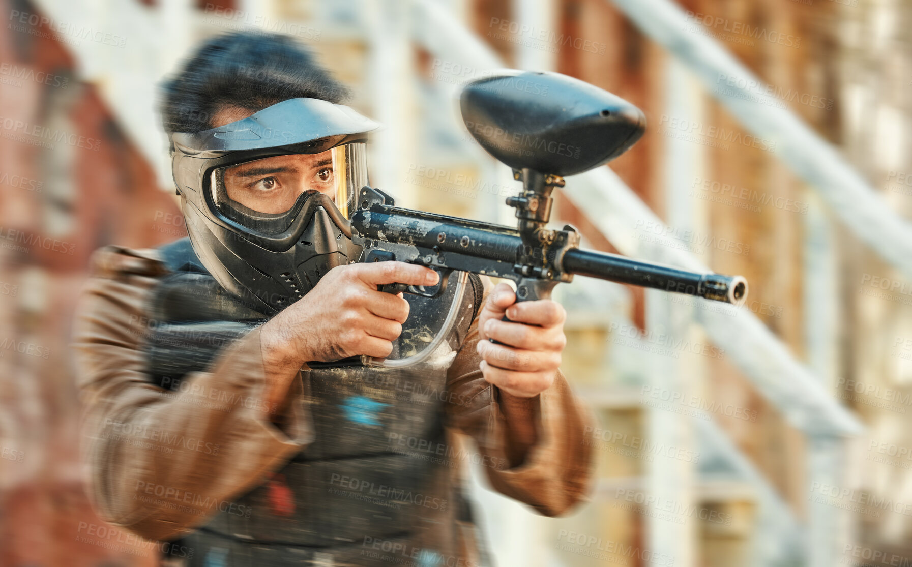 Buy stock photo Paintball, sports and man in action with blur for tournament, competition and battle in nature. Target, military and male person shooting in outdoor arena for training, adventure games and challenge