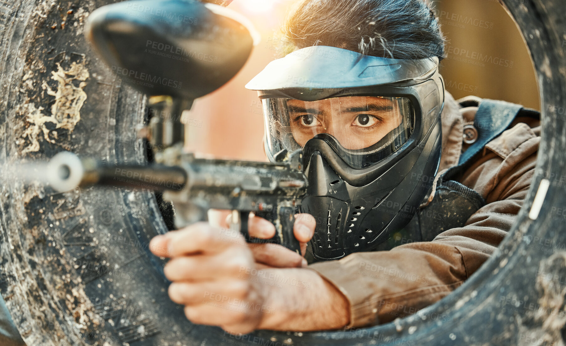 Buy stock photo Paintball, shooting and man in action with gun for tournament, competition and battle in nature. Camouflage, military and male person aim in outdoor arena for training, adventure game or challenge