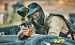 Paintball, sports and woman in action with gun for tournament, competition or battle in park. Soldier, military and female person shooting in outdoor arena for training, adventure games and challenge