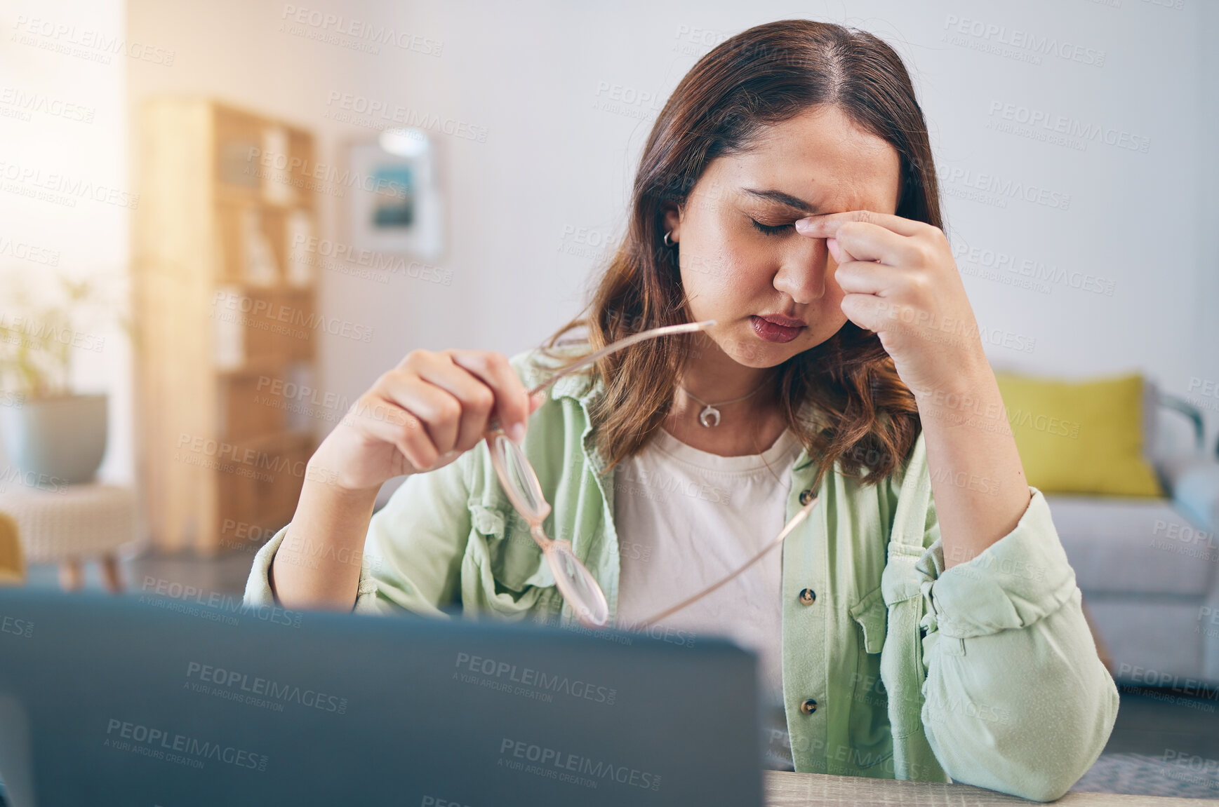 Buy stock photo Headache, stress and woman on laptop in home with deadline for project, report and online task. Remote work, overworked and female person with burnout, frustrated and worry for freelance business