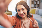 Portrait, woman and peace for selfie in home, smile and fun with live streaming vlog in living room. Face, profile picture and happy female gen z show v sign, hand emoji and memory for social media