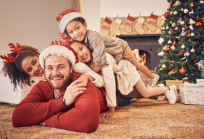 Buy stock photo Christmas, portrait and happy family in home on floor, bonding and together. Xmas, smile and face of parents with children, interracial and African mom with father for party, celebration or holiday