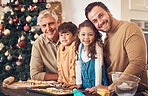 Christmas, portrait and family baking cookies in home, bonding and together. Xmas, cooking food and face smile of grandfather, dad and children with love at party, celebration and winter holiday