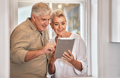 Buy stock photo Home, typing and senior couple with a tablet, love and website information with social media, chatting and sms. Technology, old man and elderly woman with happiness, search internet and connection