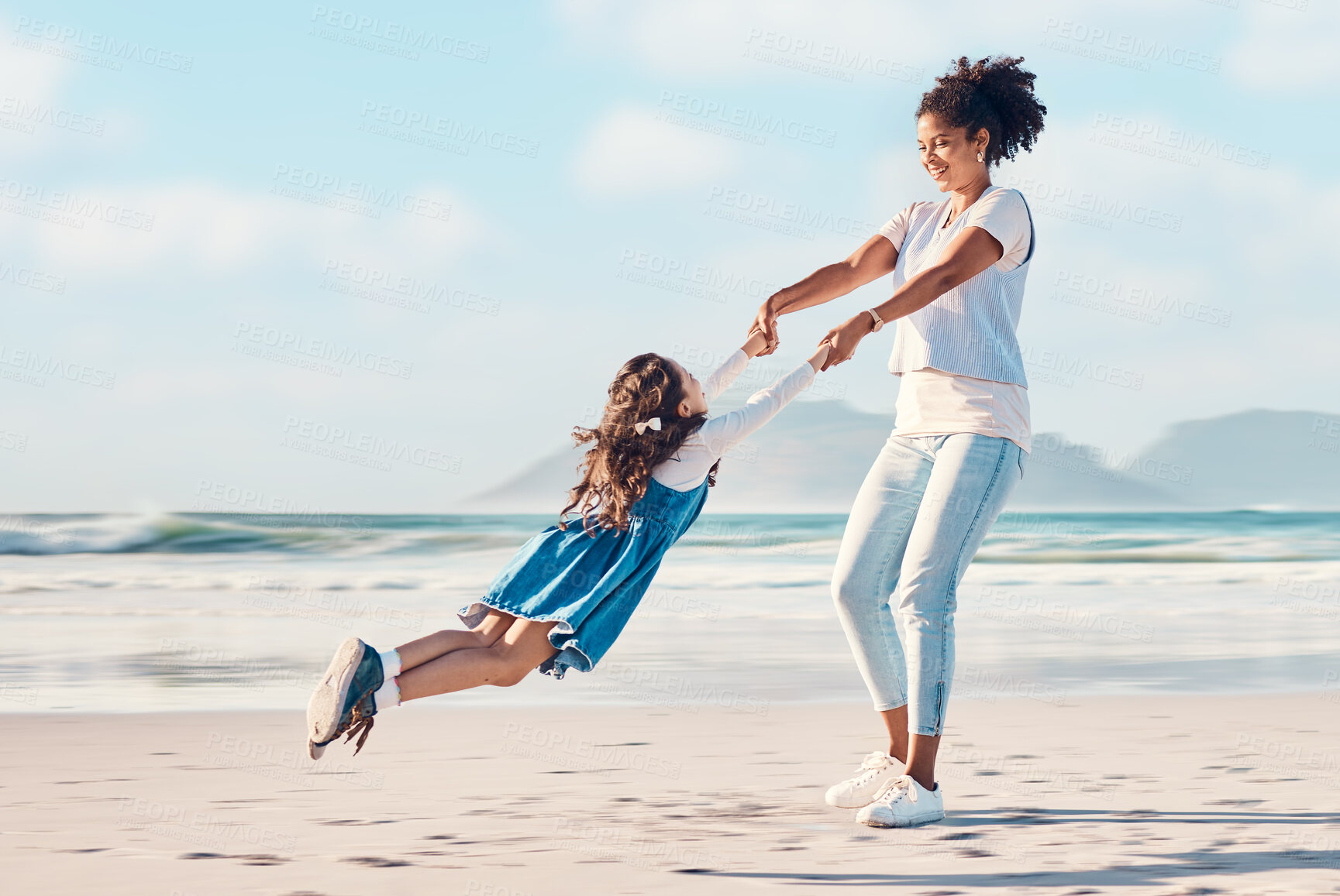 Buy stock photo Spinning, mother and a child happy at the beach while on a family vacation, holiday or adventure. A young woman or mom and girl kid playing together while outdoor for summer fun and travel in nature