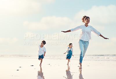 Buy stock photo Mother, son and daughter on the beach to dance together while outdoor for travel or vacation in summer. Sunset, family or children and a woman having fun with her kids on the coast by the ocean