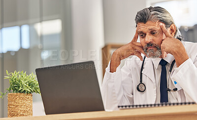 Buy stock photo Senior doctor man, laptop and headache with stress, 404 glitch or connectivity problem in hospital office. Mature medic, pc and reading bad results for thinking, anxiety and fear in healthcare job