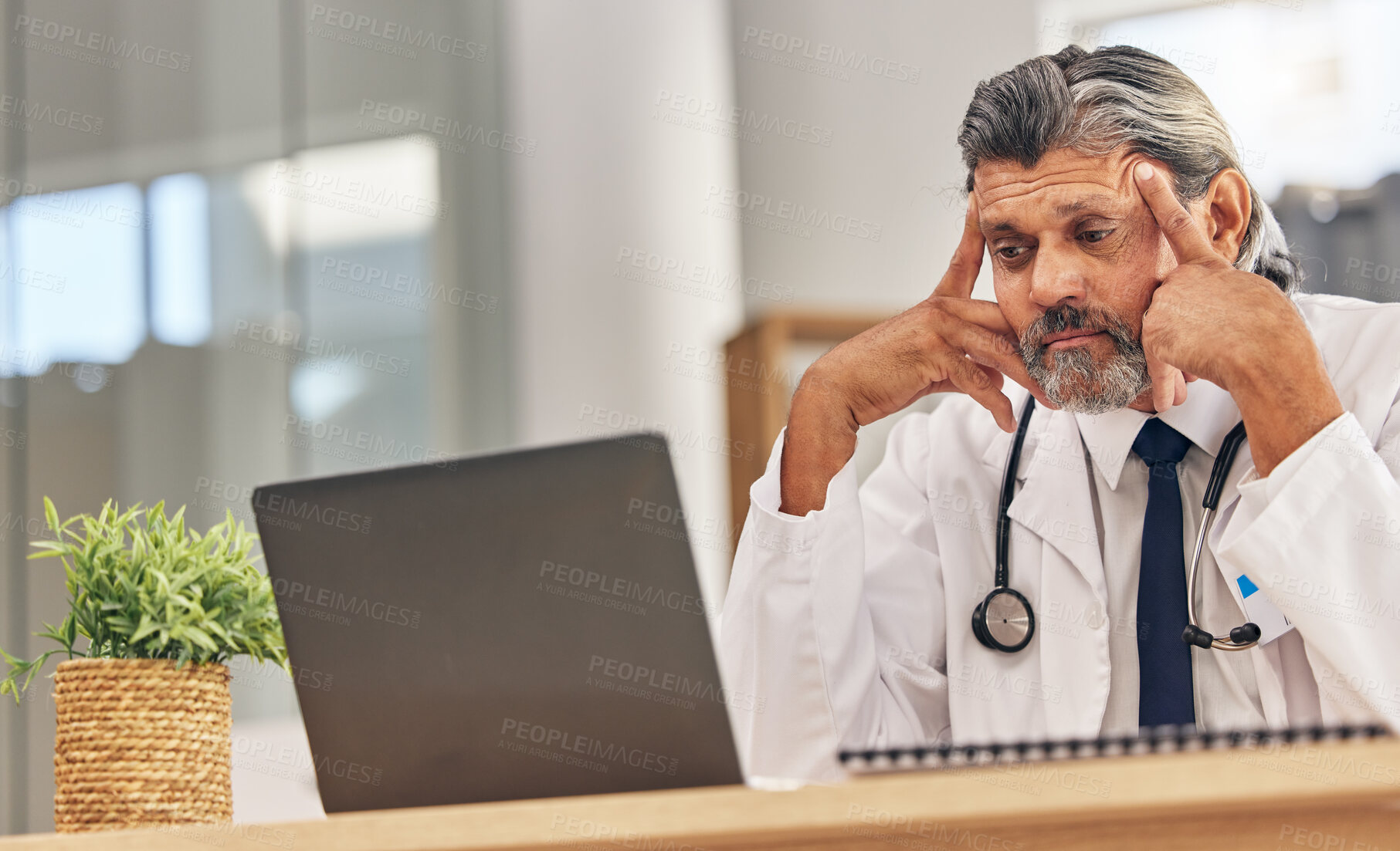 Buy stock photo Senior doctor man, laptop and headache with stress, 404 glitch or connectivity problem in hospital office. Mature medic, pc and reading bad results for thinking, anxiety and fear in healthcare job