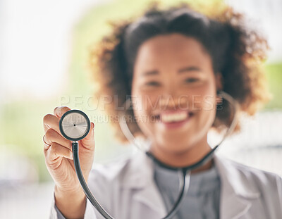 Buy stock photo Healthcare, stethoscope and cardiology with a doctor in the hospital for a routine checkup during an appointment. Medical, hand and heart health with a woman medicine professional in a clinic