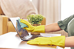 Cleaning, laptop and hands of woman in home with rubber gloves for hygiene, disinfection and washing. Cleaner service, housekeeping and closeup of female maid wipe dust, dirt and stain on computer