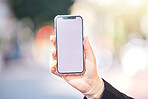 Woman, hands and phone with screen mockup in city for advertising, social media or outdoor communication. Closeup of female person or mobile smartphone display for online app or network in urban town
