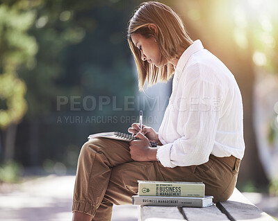 Buy stock photo Woman, writing and student with books at park outdoor to study for future in business management. Studying, learning or knowledge of a young female person in nature with notebook for school education