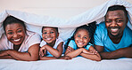 Smile, black family and portrait in a bed with blanket, relax and comfort on the weekend in their home. Happy, face and children with parents in bedroom playing, cover and rest, fun and cheerful 