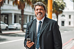Portrait, business and senior man with a smartphone, city and smile with connection, typing and social media. Face, male person outdoor and consultant with a cellphone, connectivity and mobile app