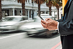 Hands, phone and commute with a business man in the city using an app for location, navigation or direction. Mobile, travel and communication with a male employee typing a message in an urban town