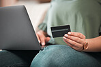 Hand, laptop and credit card for online shopping with a customer on the internet from home. Computer, ecommerce and payment with a person using a bank app for finance, accounting or budget planning