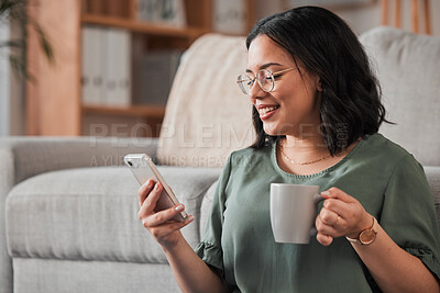 Buy stock photo Woman, coffee and typing with phone in living room for social media post, reading notification or tech chat. Happy person, drinking tea and scroll on smartphone, download app and mobile games at home