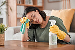 Tired woman, housekeeper and headache with detergent for cleaning furniture, hygiene or bacterial removal at home. Exhausted female person, cleaner or maid in burnout or overworked from housework