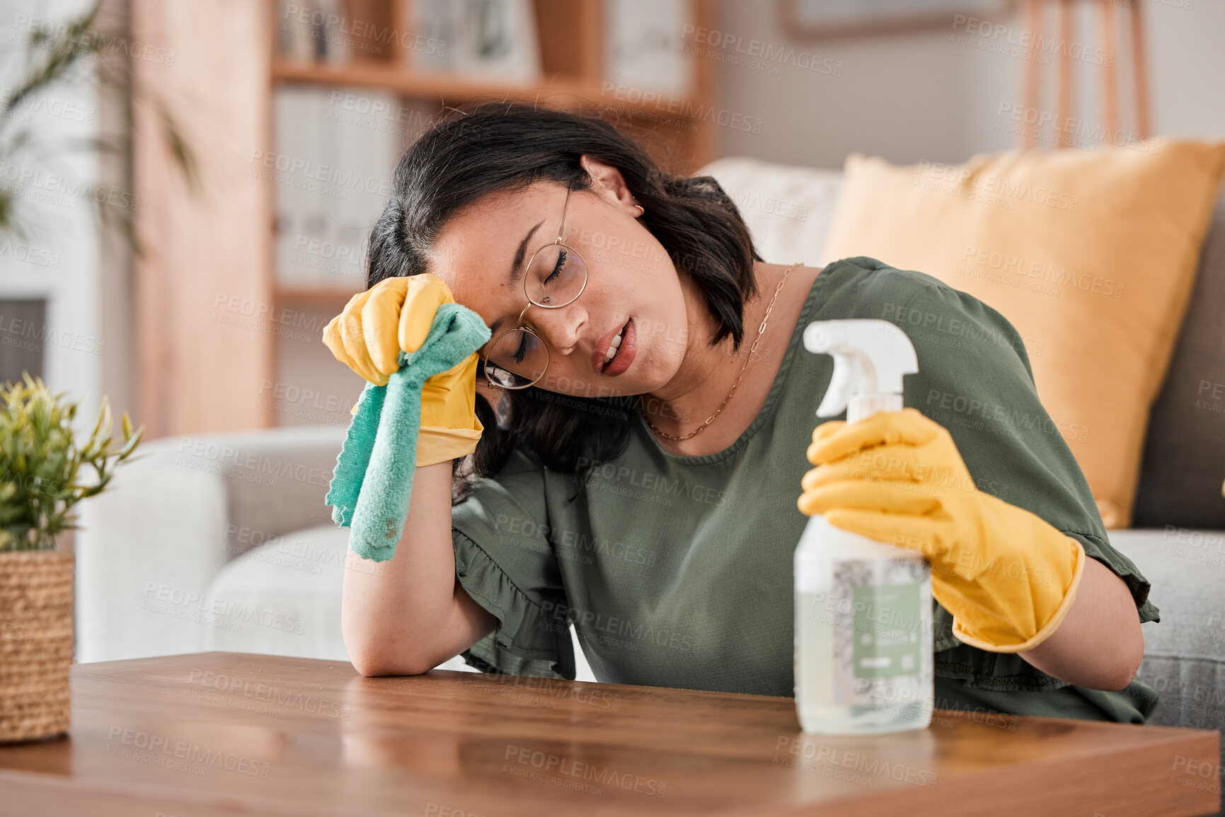Buy stock photo Tired woman, housekeeper and headache with detergent for cleaning furniture, hygiene or bacterial removal at home. Exhausted female person, cleaner or maid in burnout or overworked from housework
