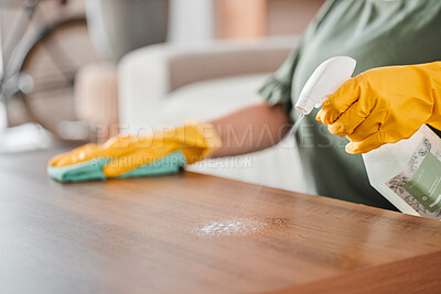 Buy stock photo Hands, cleaning and spray on a wooden table for hygiene, disinfection or to sanitize a surface in a home. Gloves, bacteria and product with a woman cleaner in the living room for housework or chores