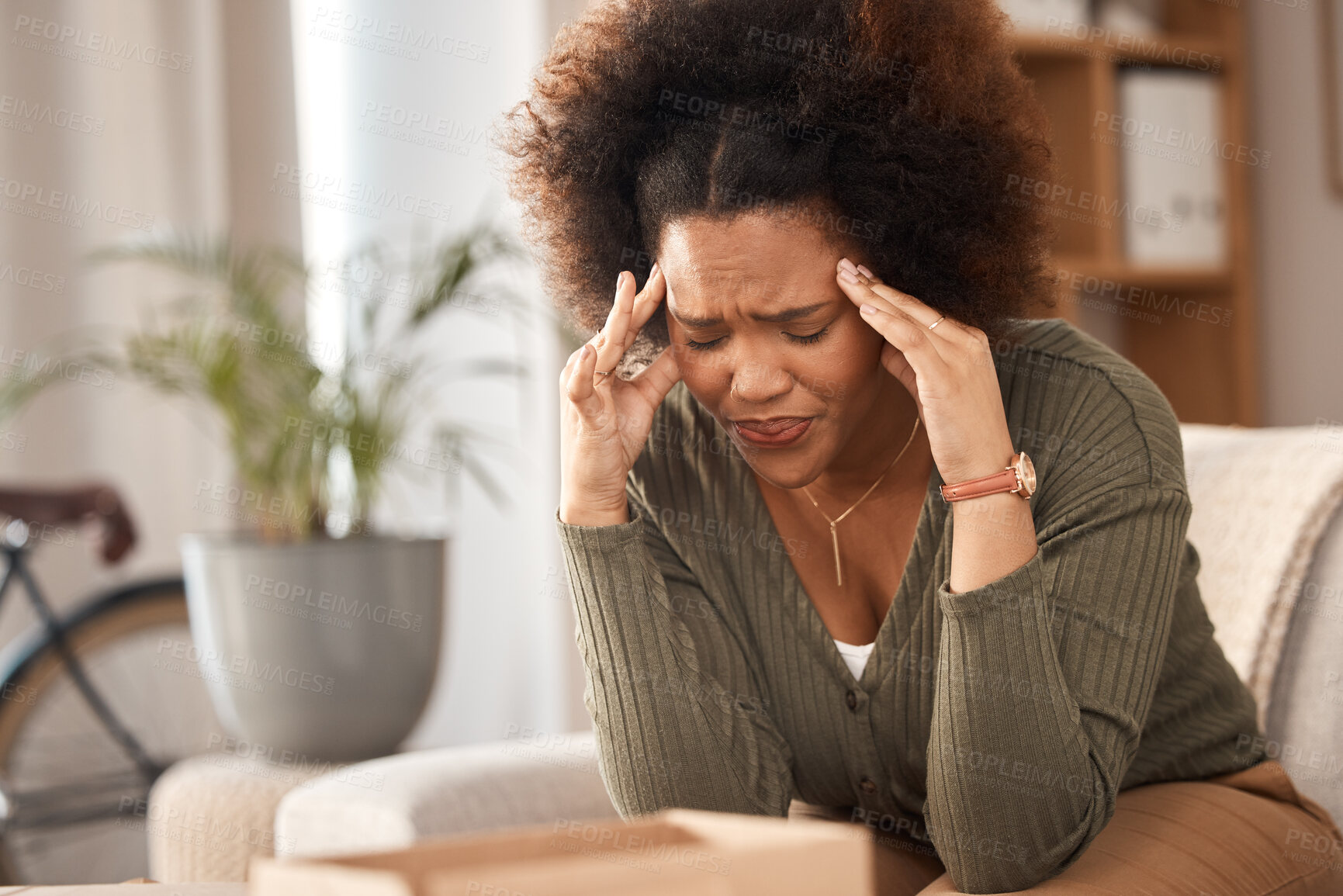 Buy stock photo Headache, woman and pain in home from stress, mental health problem and fatigue. Depression, sick and frustrated female with anxiety, burnout and tired from brain fog, vertigo and debt crisis