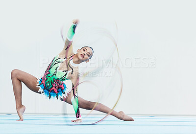 Buy stock photo Gymnastics performance, woman and ribbon in portrait for competition, sport or fitness on studio floor. Gymnast, athlete girl and professional dancer with balance, training or contest with creativity