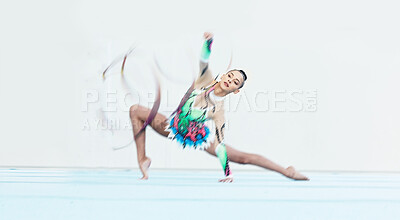Buy stock photo Gymnastics performance, woman and ribbon on floor for competition, sport or fitness with stretching. Gymnast, athlete girl and professional dancer with balance, training or contest with motion blur