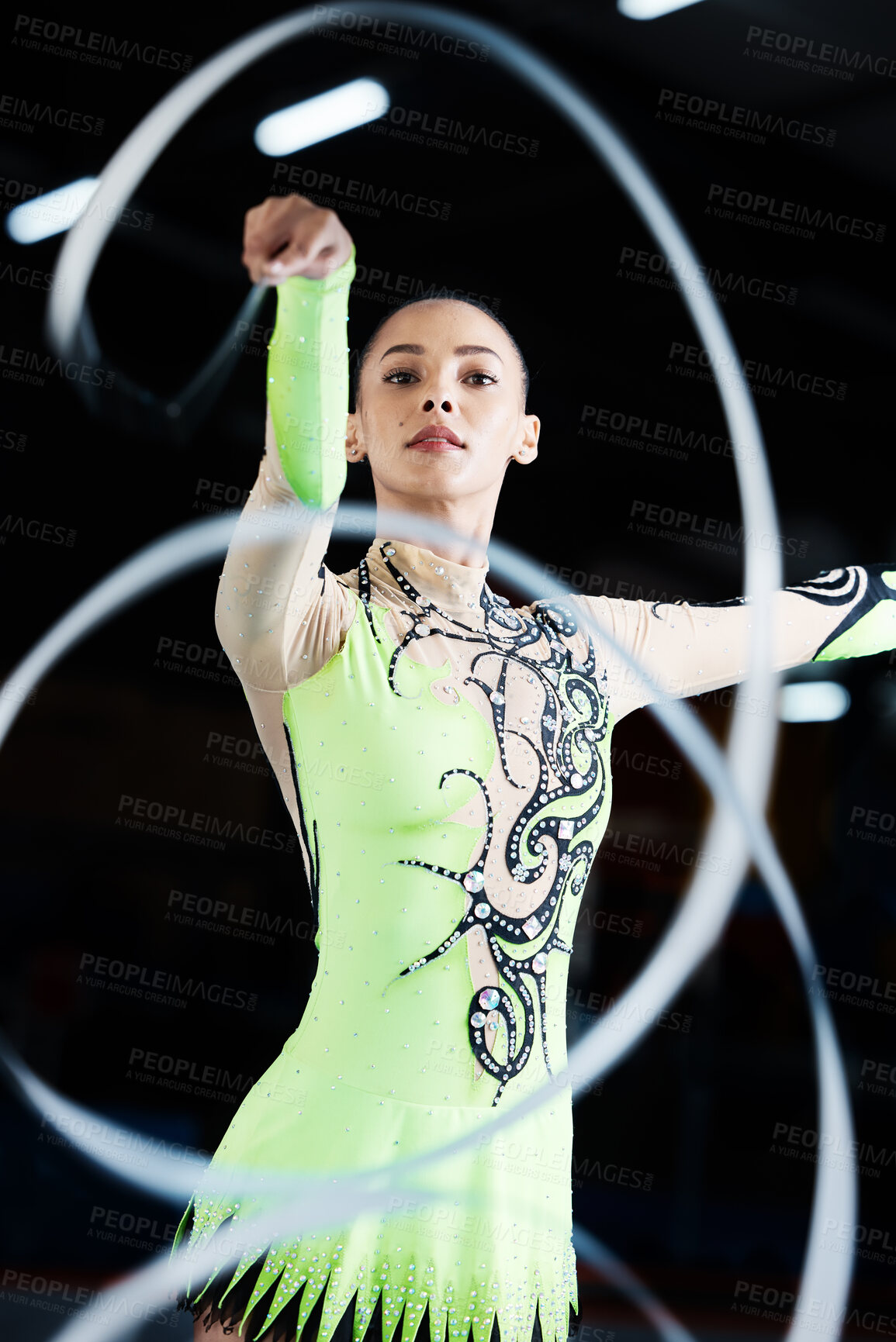 Buy stock photo Gymnastics, dance performance and woman with ribbon for rhythmic movement, training and exercise. Aerobics practice, sports and female person in action for competition, workout and creative dancing
