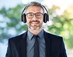 Face, senior and business man with headphones outdoor for music podcast. Portrait, elderly and happy ceo listening to radio, audio or hearing sound with smile for jazz, hip hop and song on bokeh.
