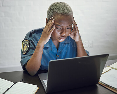 Buy stock photo Police, woman with headache and working with stress on computer or frustrated with case, report or anxiety in security. African, officer and tired from work on documents in office or station
